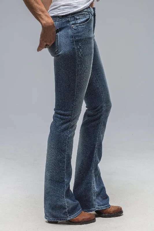 Shop the Weekend Away Tommy Ripped & Repaired Flare Jeans in Lt. Blue